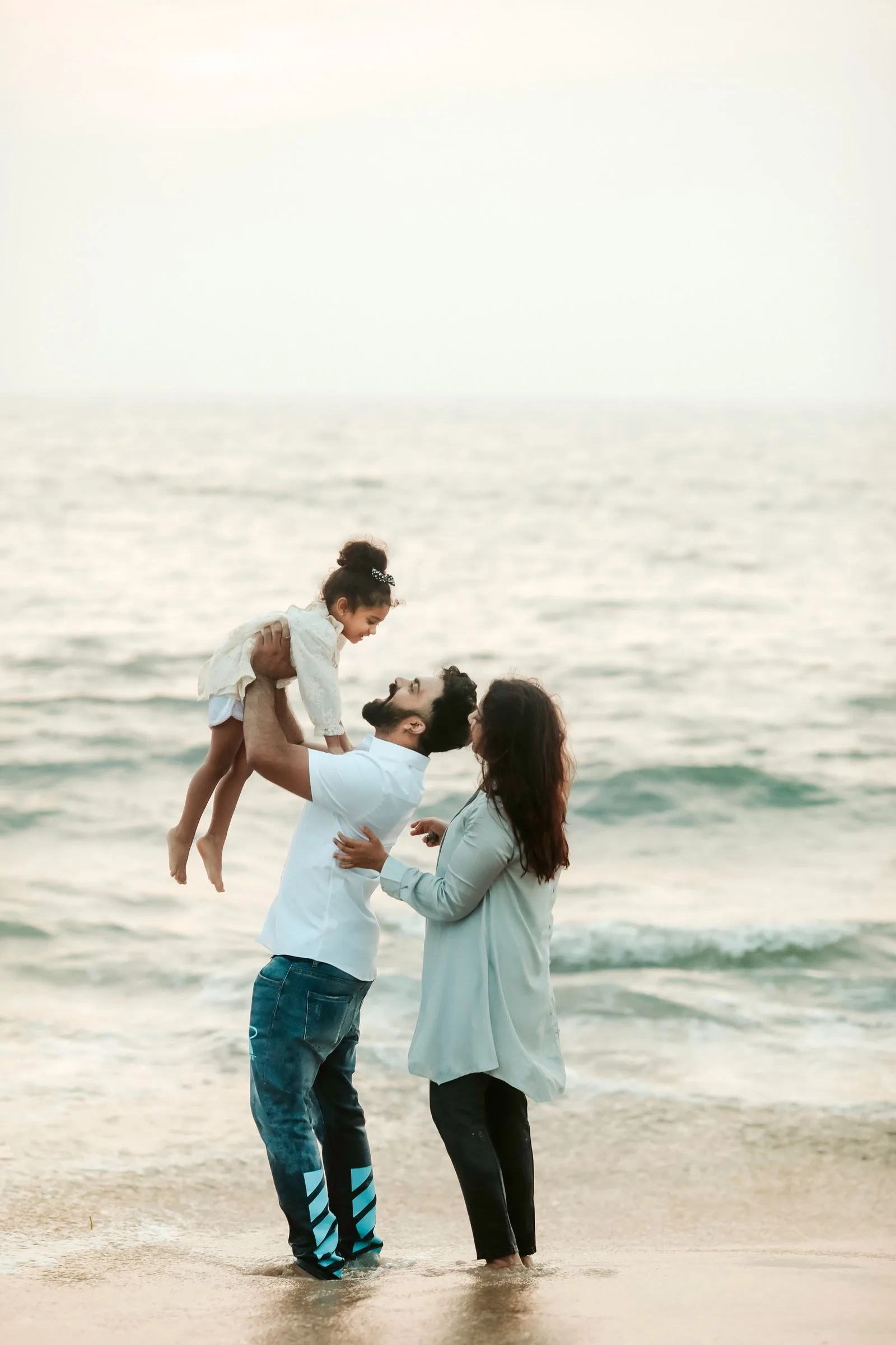 Family enjoying a holiday by the sea